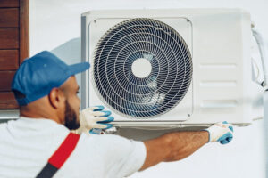 AC Technician completing AC Tune-Up in preparation for summer.