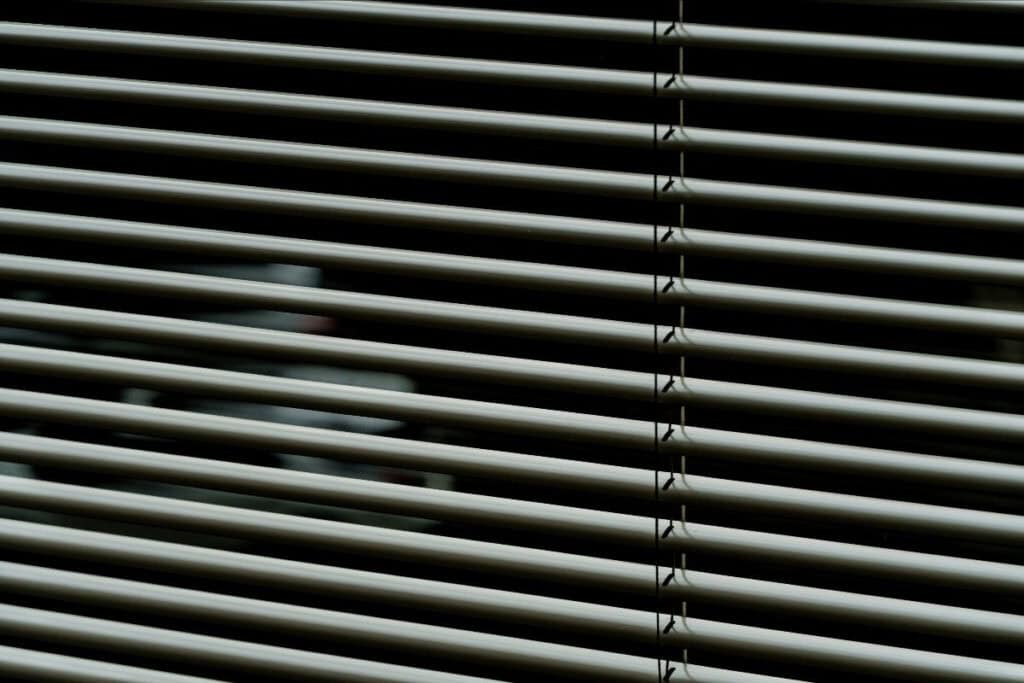 Venetian blinds shielding from the intense Oklahoma heat.
